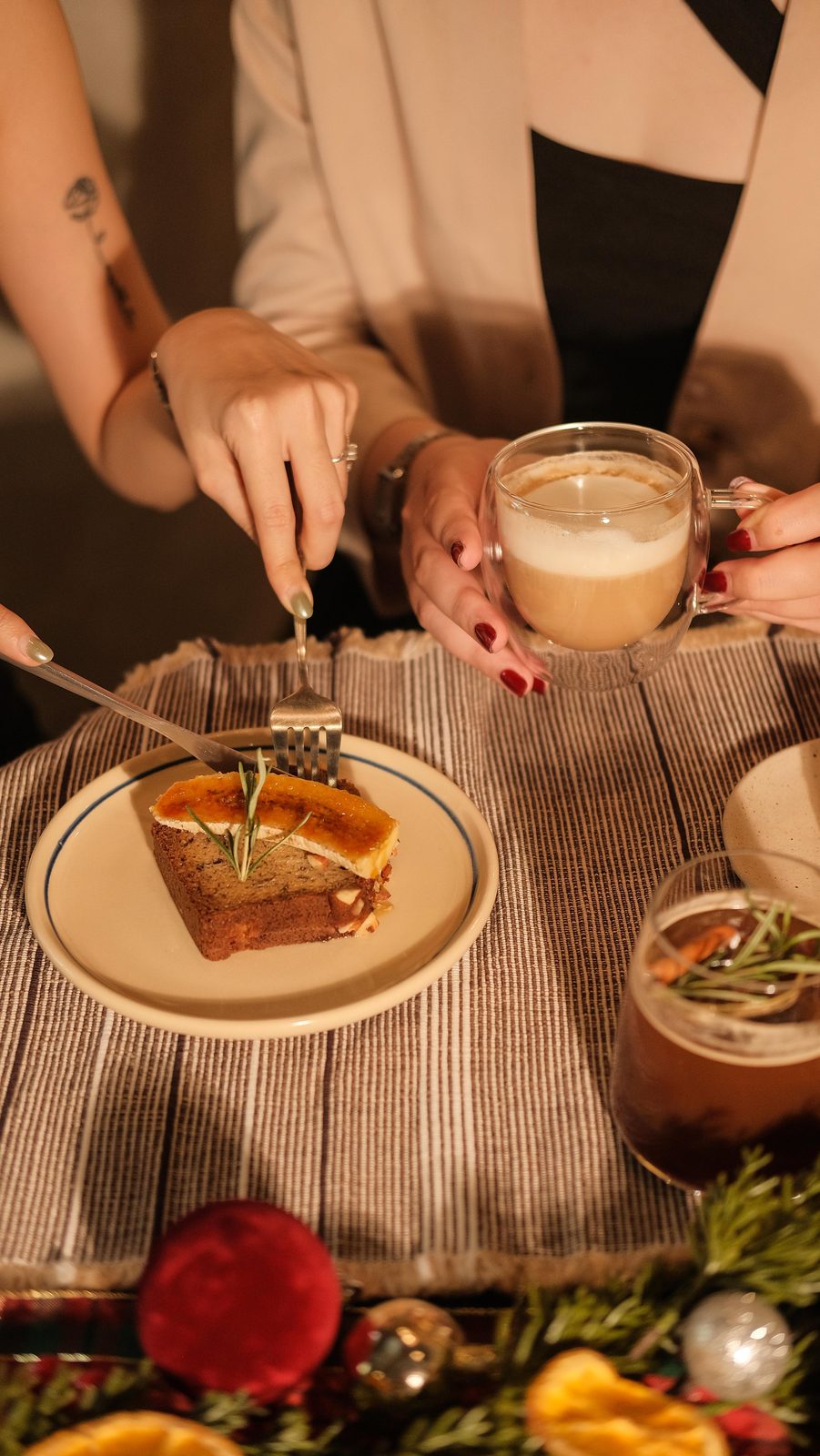 Hands assembling a pour-over set-up at the bar