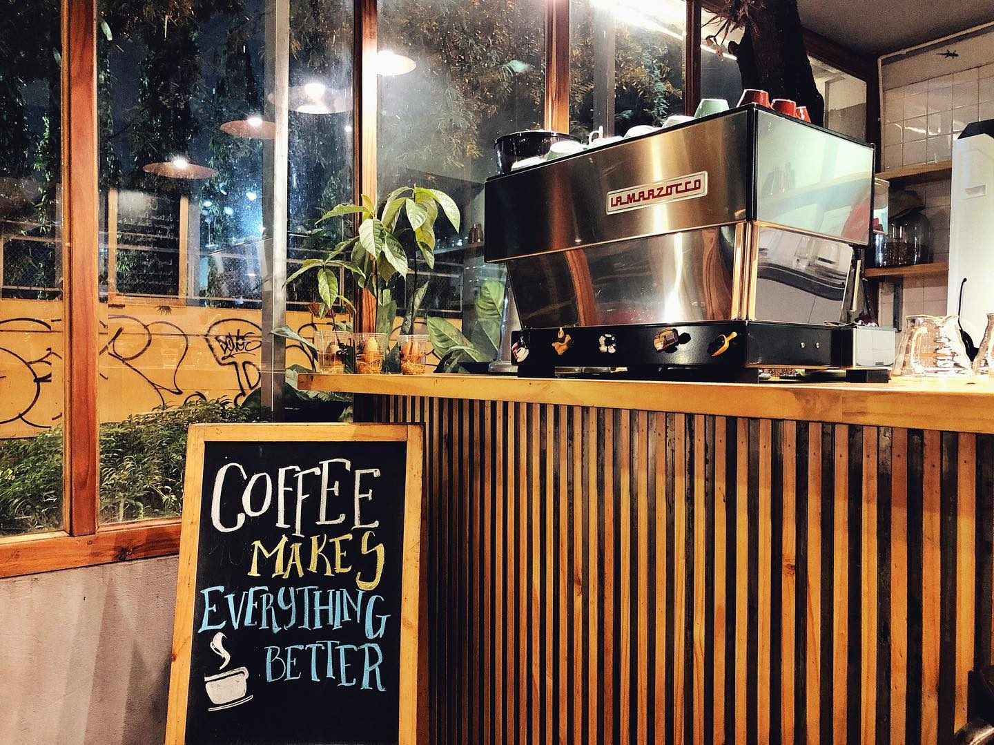 The chalkboard: “Coffee make everything better”