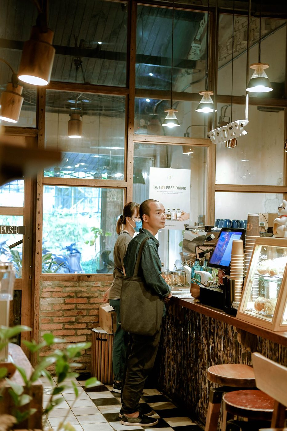 Lush garden; vine-covered exterior, courtyard interior, candid customers