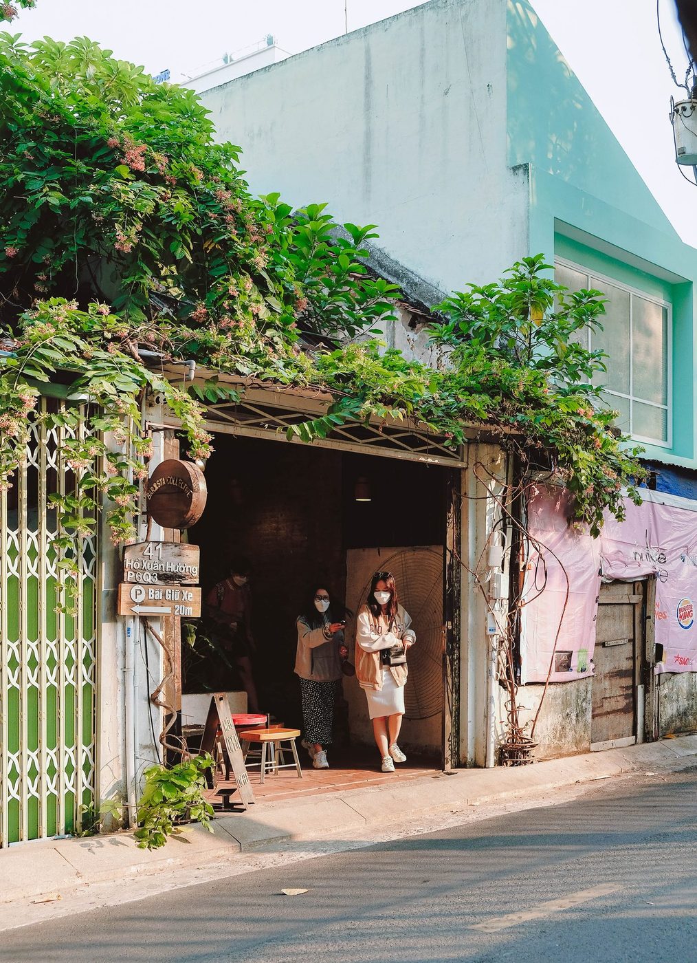 Lush garden; vine-covered exterior, courtyard interior, candid customers