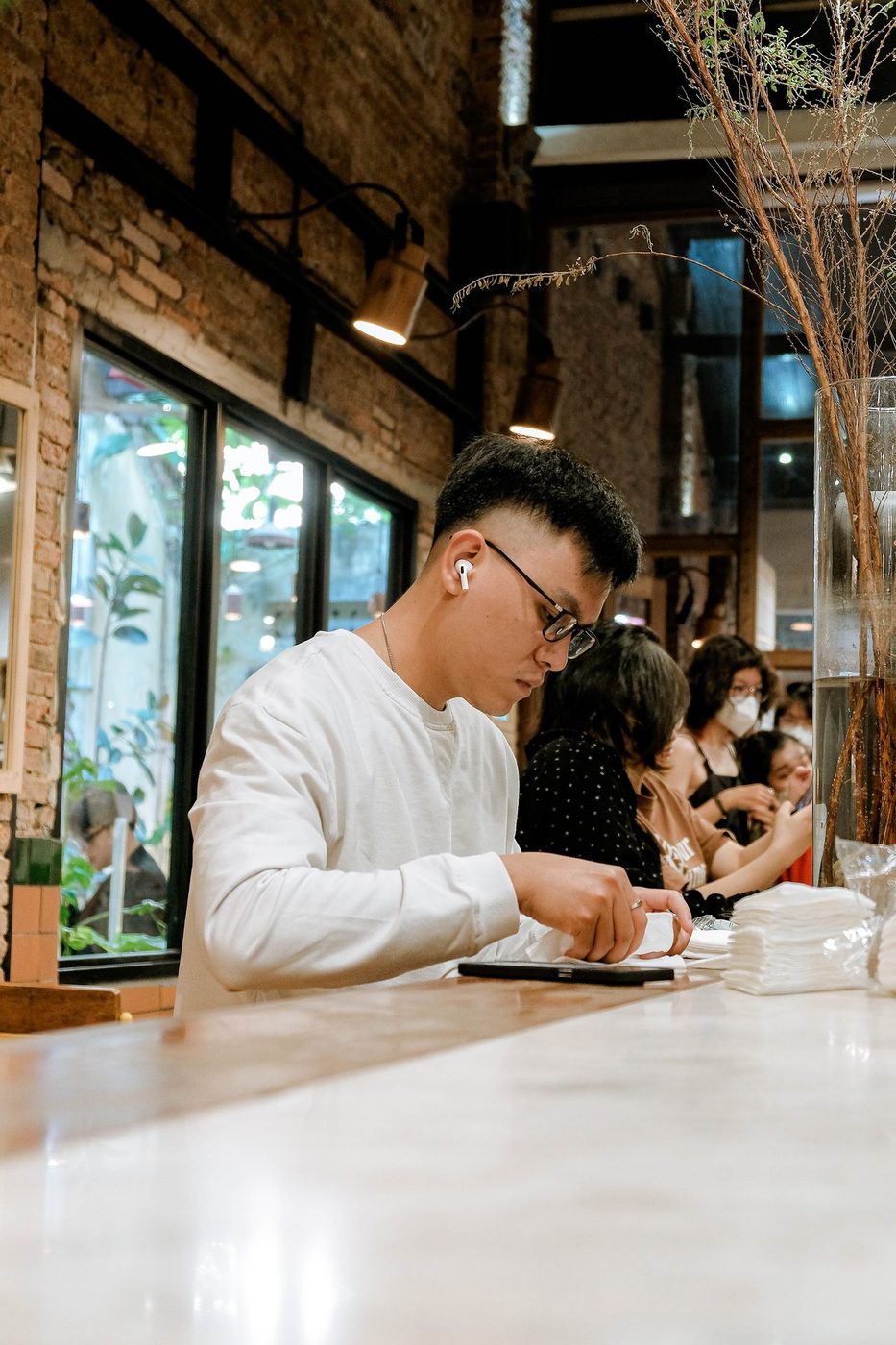 Lush garden; vine-covered exterior, courtyard interior, candid customers