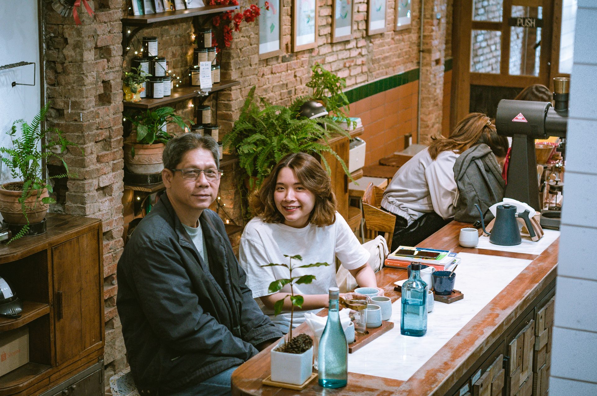 Father and daughter at the bar.