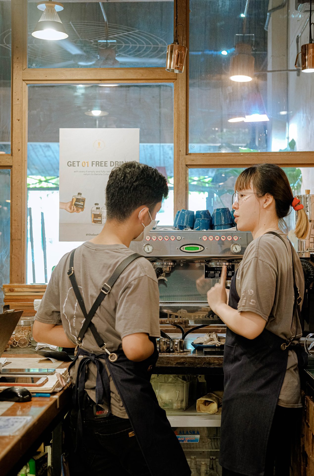 Two baristas, between orders.
