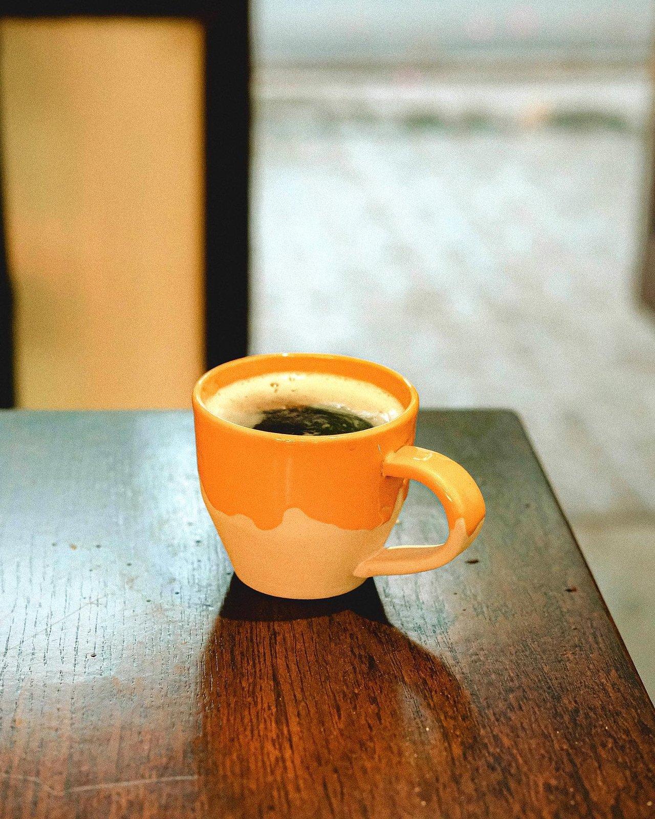 Black coffee on a wooden table