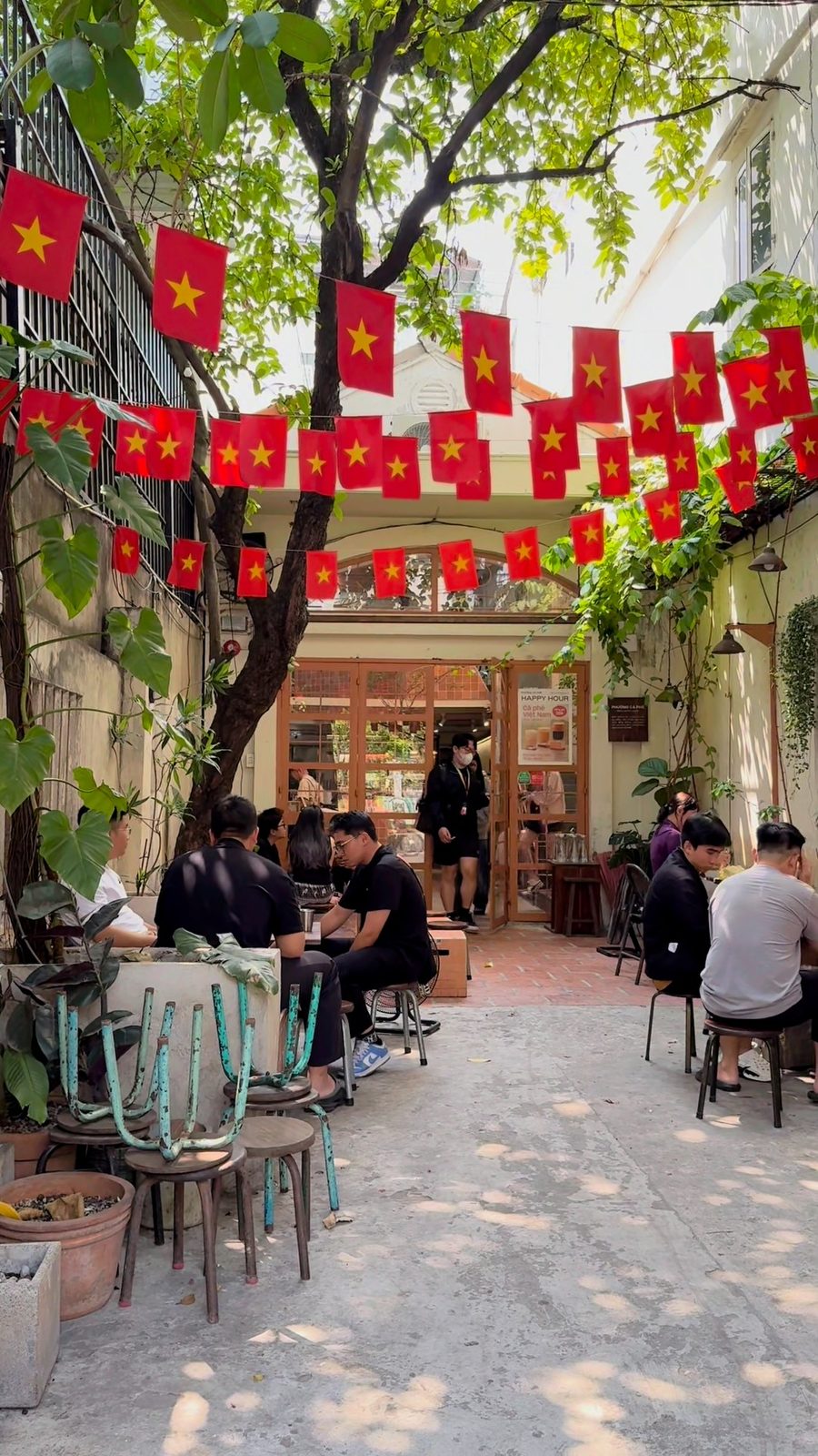 Courtyard with flags and greenery