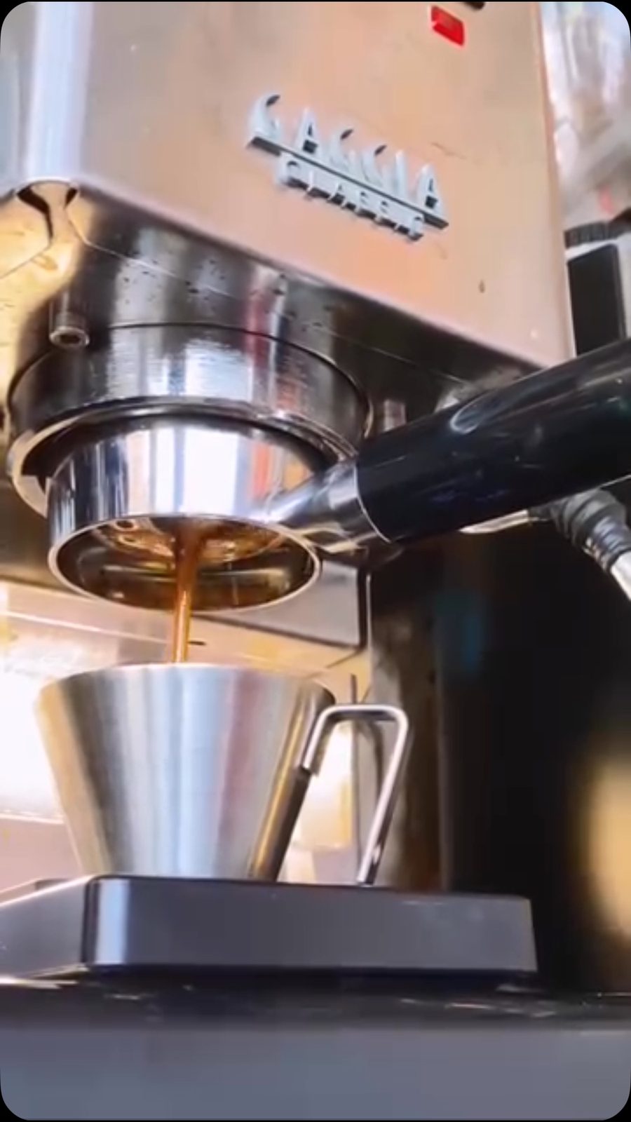The espresso machine pulling a shot